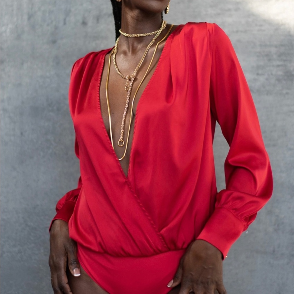 Brand new, never worn red satin bodysuit. Still with tags.